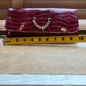 Never used, dark red faux leather, alligator pattern, clutch/wristlet